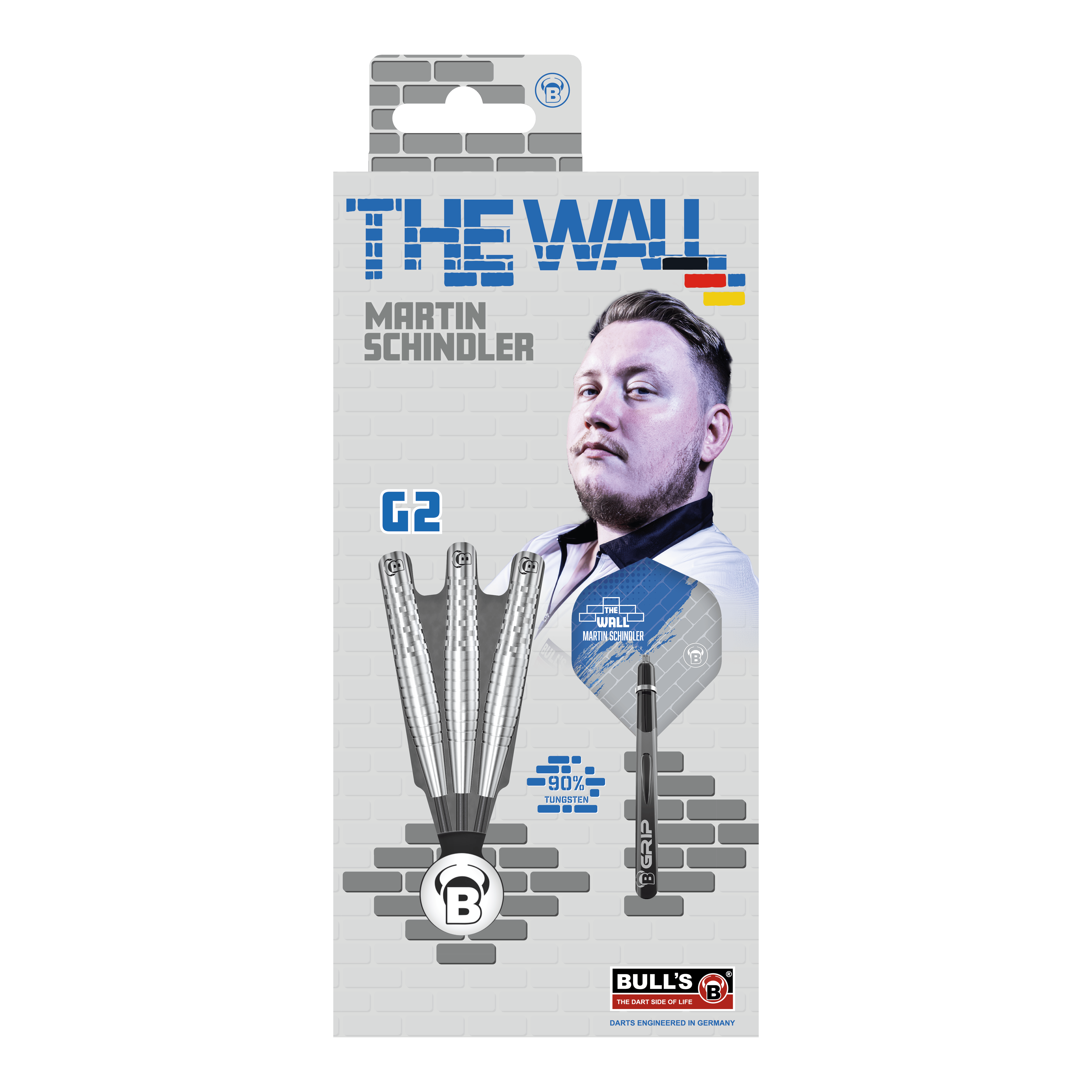 Bulls Martin Schindler Original Generation 2 freccette in acciaio Die Verpackung zeigt die "Bulls Martin Schindler Original Generation 2 Steeldarts" mit dem Bild von Martin Schindler. Auf der Vorderseite sind drei Darts und die Aufschrift "THE WALL" sowie "90% Tungsten" abgebildet.