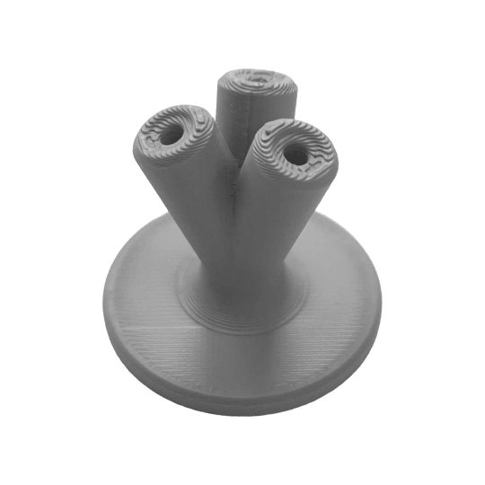 NYT Studio Compact Dart Holder Hier sieht man einen kompakten Dart-Halter in Grau. Dieses Zubehör ist praktisch für die Aufbewahrung von Darts.