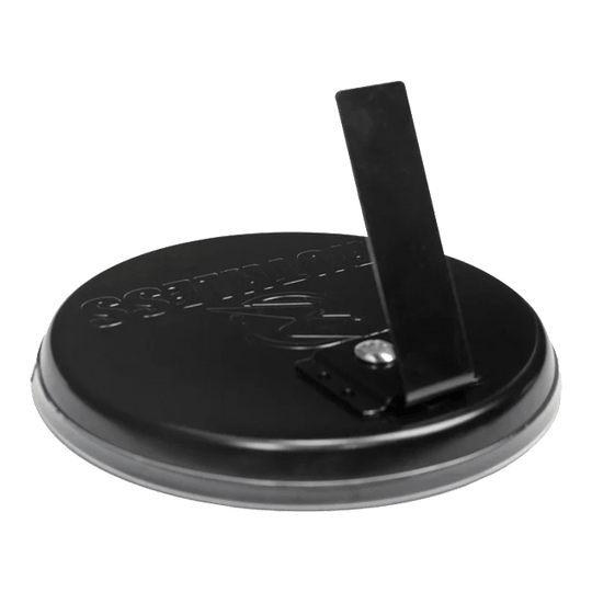 Zestaw do darta Ruthless Mini Desktop Das Bild zeigt die Rückseite eines Produkts namens "Ruthless Mini Desktop Dartboard Set". Es ist eine runde schwarze Basis mit einem klappbaren Ständer.