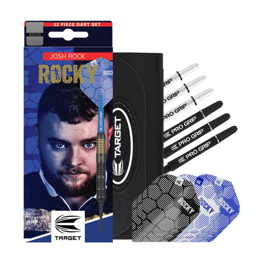 Šipky Target Josh Rock Brass měkké - 18g Das Bild zeigt das Produkt "Target Josh Rock Brass Softdarts - 18g" mit Zubehör wie Flights und Shafts. Auf der Verpackung ist ein Porträt sowie der Name des Spielers Josh Rock zu sehen.