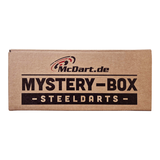 Phil Taylor Mystery Soft Dart Fan Box Auf dem Bild ist eine braune Box mit der Aufschrift "McDart.de Mystery-Box Steeldarts" zu sehen. Es handelt sich um eine Überraschungsbox für Steeldart-Fans.